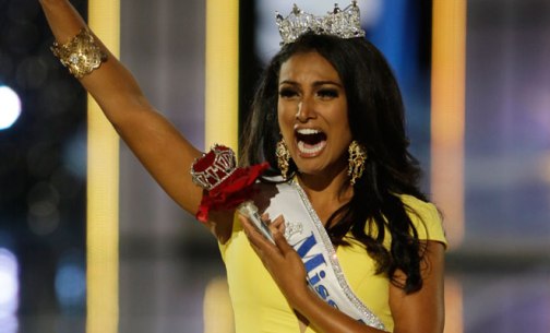 Miss New York, Nina Duvaluri rejoicing after being crowned Miss America.